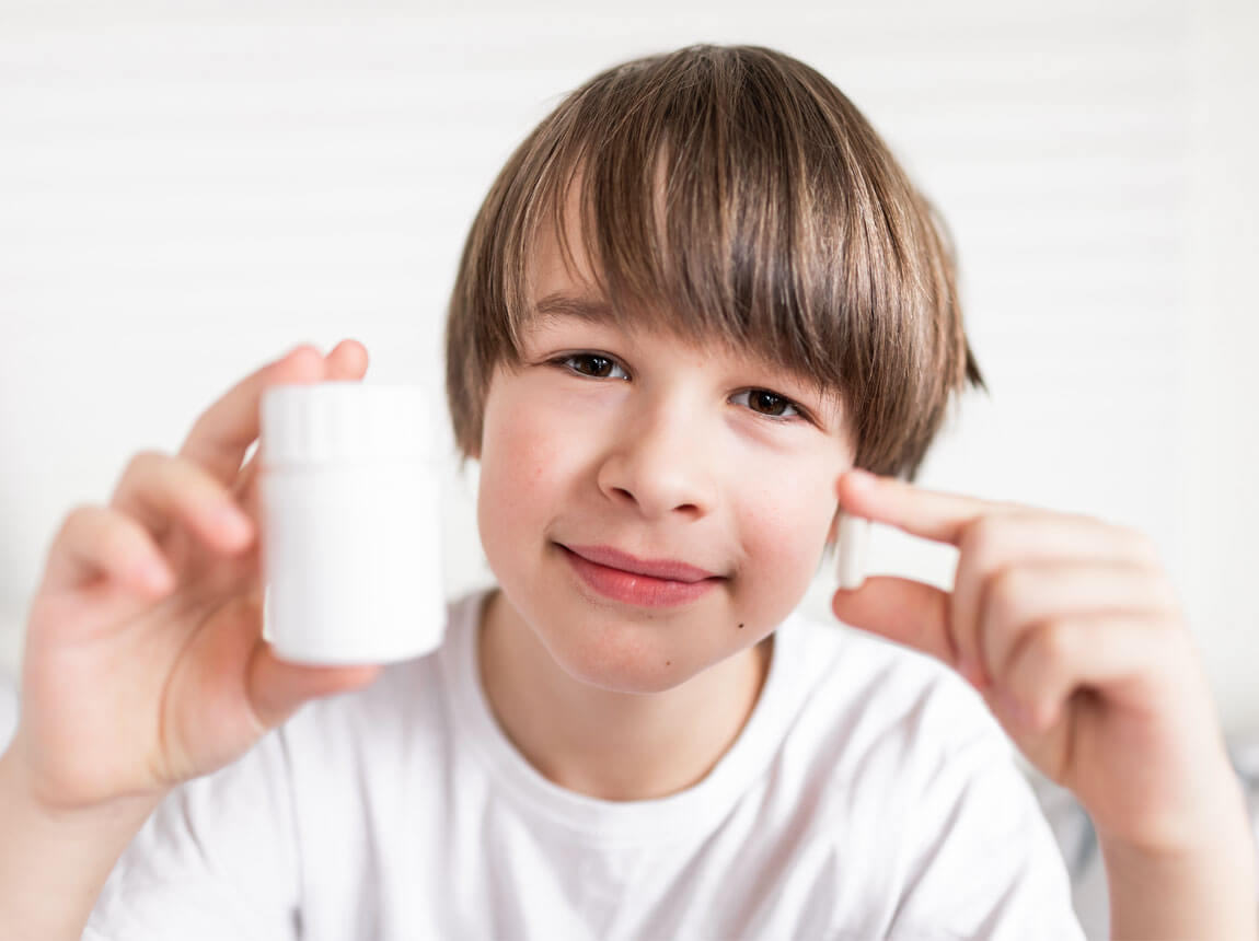 дитина з капсулами заліза